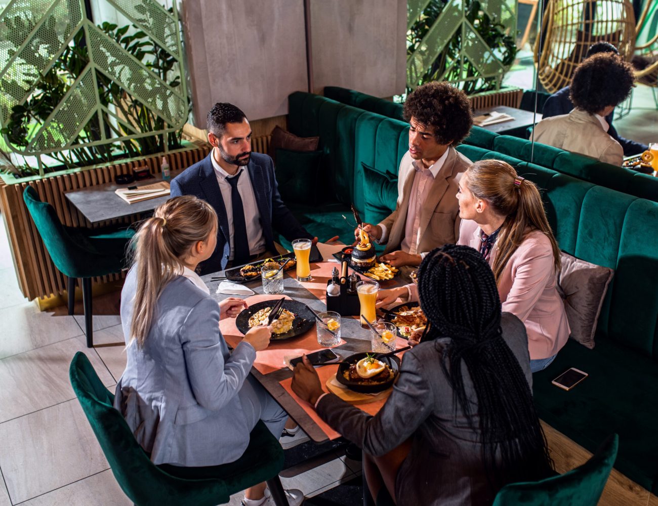 Group of business people in restaurant at lunch.
